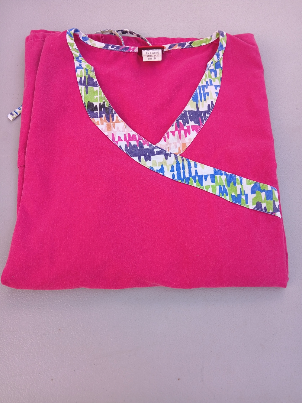 Bright Pink V-Neck Scrub Top with Multicolor Printed Trim
